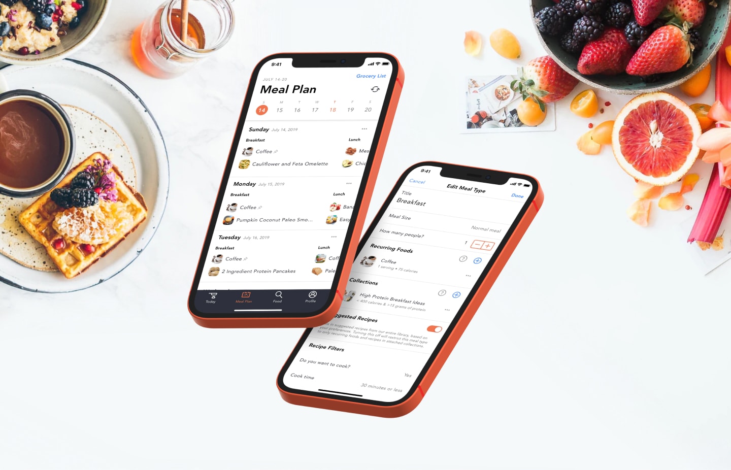 Two phones float above a spread of food